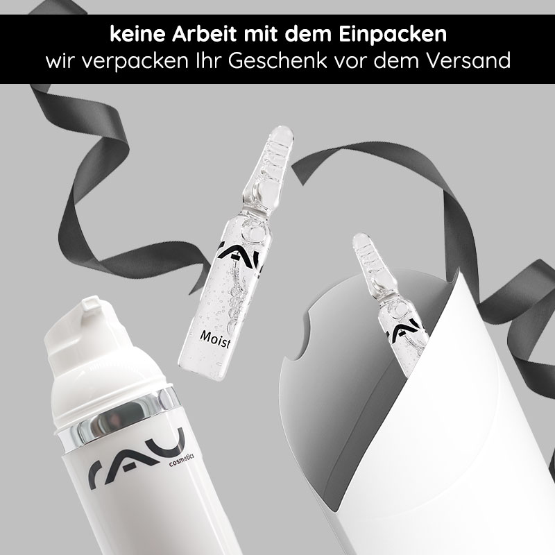 Geschenkverpackung "Kissen" mit schwarzer Schleife Geschenkverpackung mit schwarzer Schleife und RAU Cosmetics Produkten, inklusive einer Ampulle mit "Moist"-Label und einem weißen Behälter, ideal für besondere Anlässe.