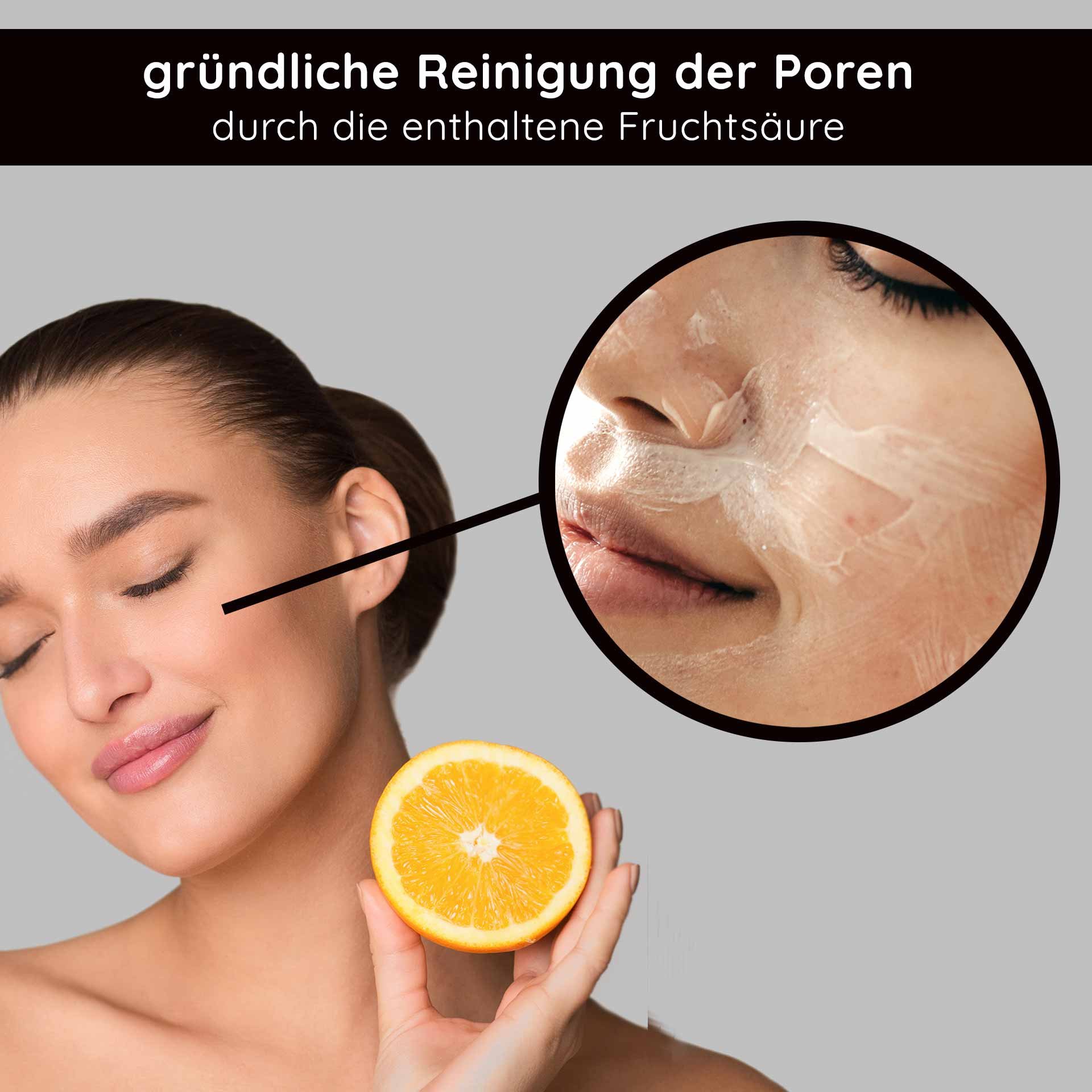 Femme avec un agrume orange, utilisant un nettoyant visage aux acides de fruits, soulignant le nettoyage en profondeur des pores.